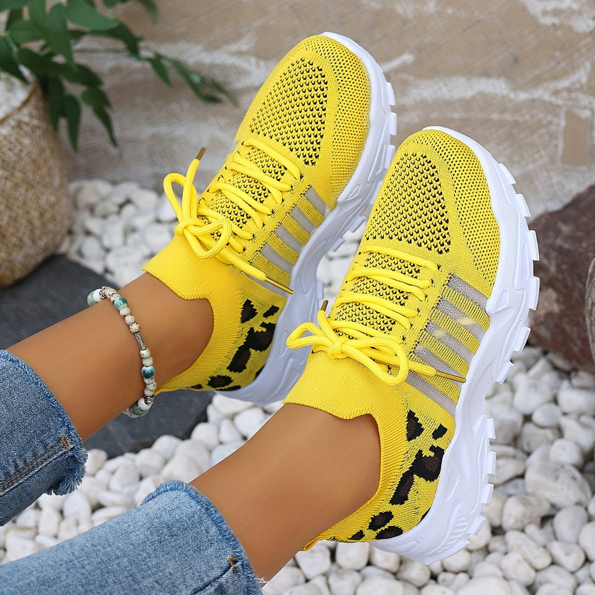 Breathable mesh leopard print sneakers with comfortable platform sole and stylish low-top design.