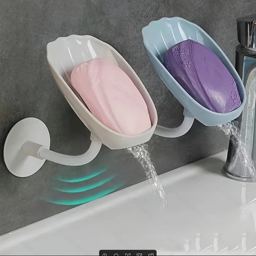 Wall-mounted, self-draining soap dish with lotus leaf design, for bathroom or kitchen. No-hole installation, plastic material.