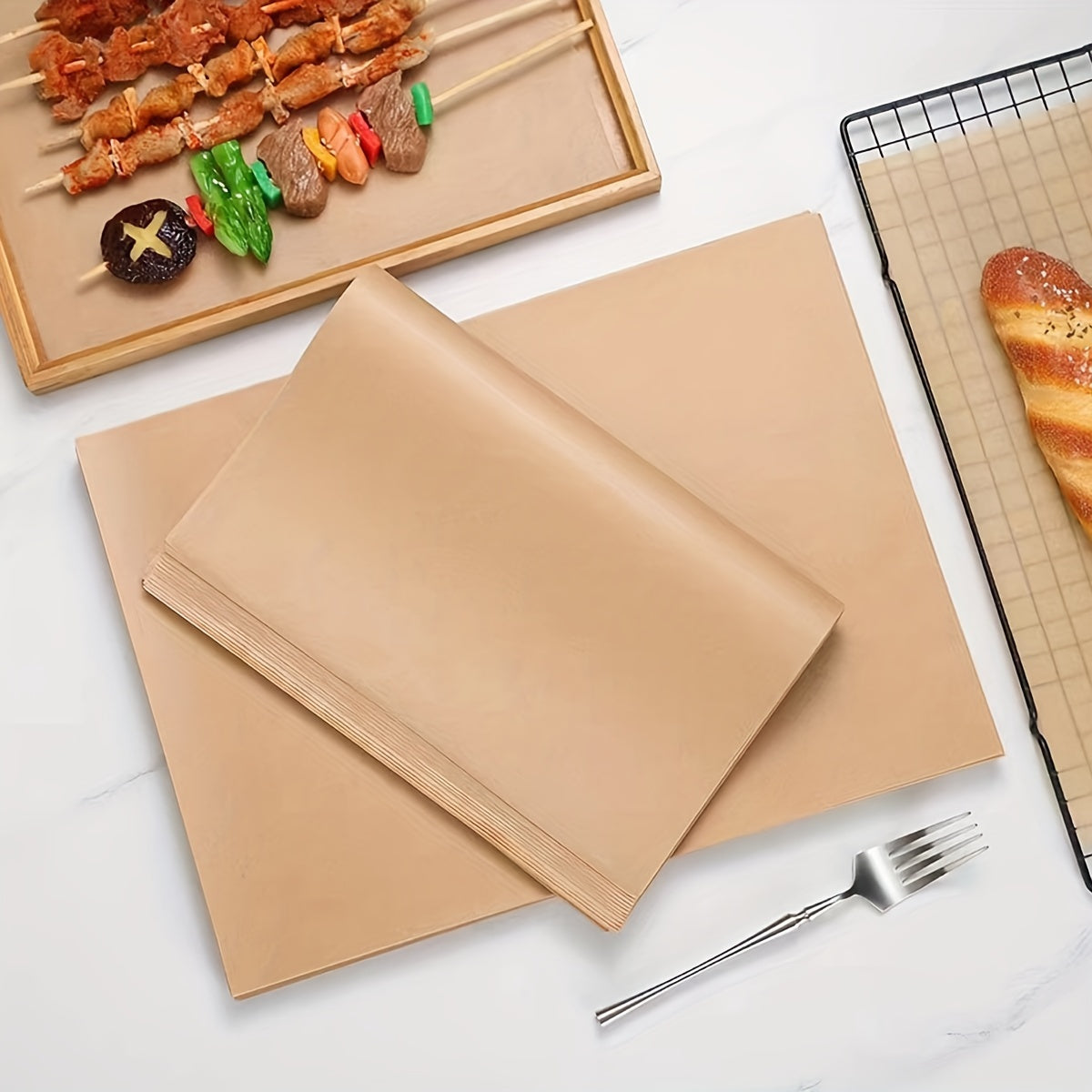 50 individual sheets of pre-cut non-stick unbleached parchment paper, free of lead, perfect for baking, cooking, grilling, frying, and steaming - ideal for use with a variety of baking pans.