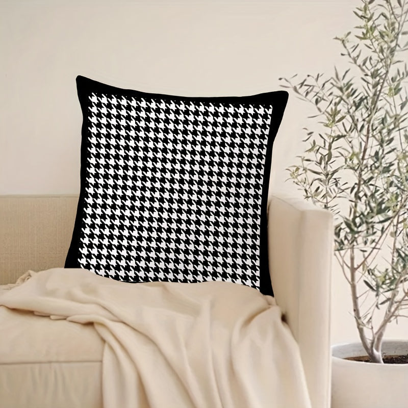 This stylish houndstooth throw pillow cover features a chic design, measuring 44.96cm square. The double-sided print is made of soft polyester and includes a convenient zip closure. Perfect for adding a touch of elegance to your living room or bedroom