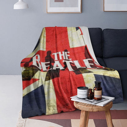 Stay warm and cozy with the ultra-soft Beatles Union Jack fleece throw blanket. Perfect for all seasons, this polyester blanket makes an ideal birthday or Christmas gift. With a contemporary style and knitted flannel in red, white, and blue, this blanket