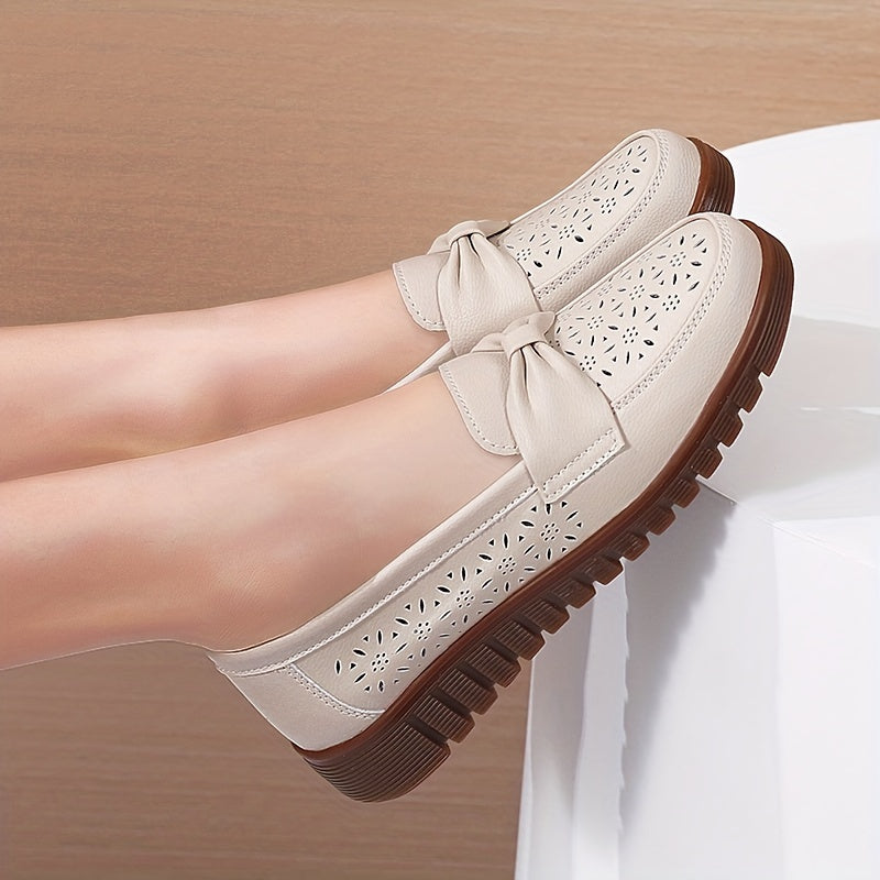 Women's breathable closed toe flat shoes with hollow out design.