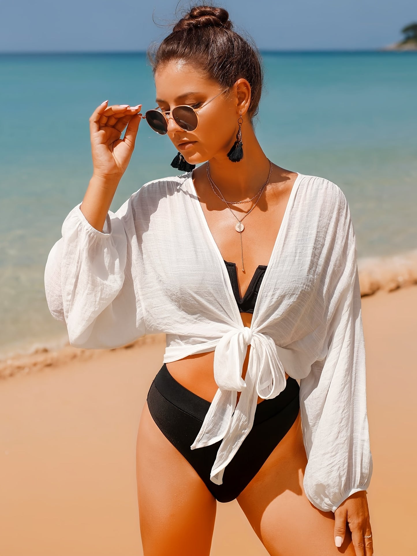 Women's swimwear cover up top with long sleeves and self-tie design for women.