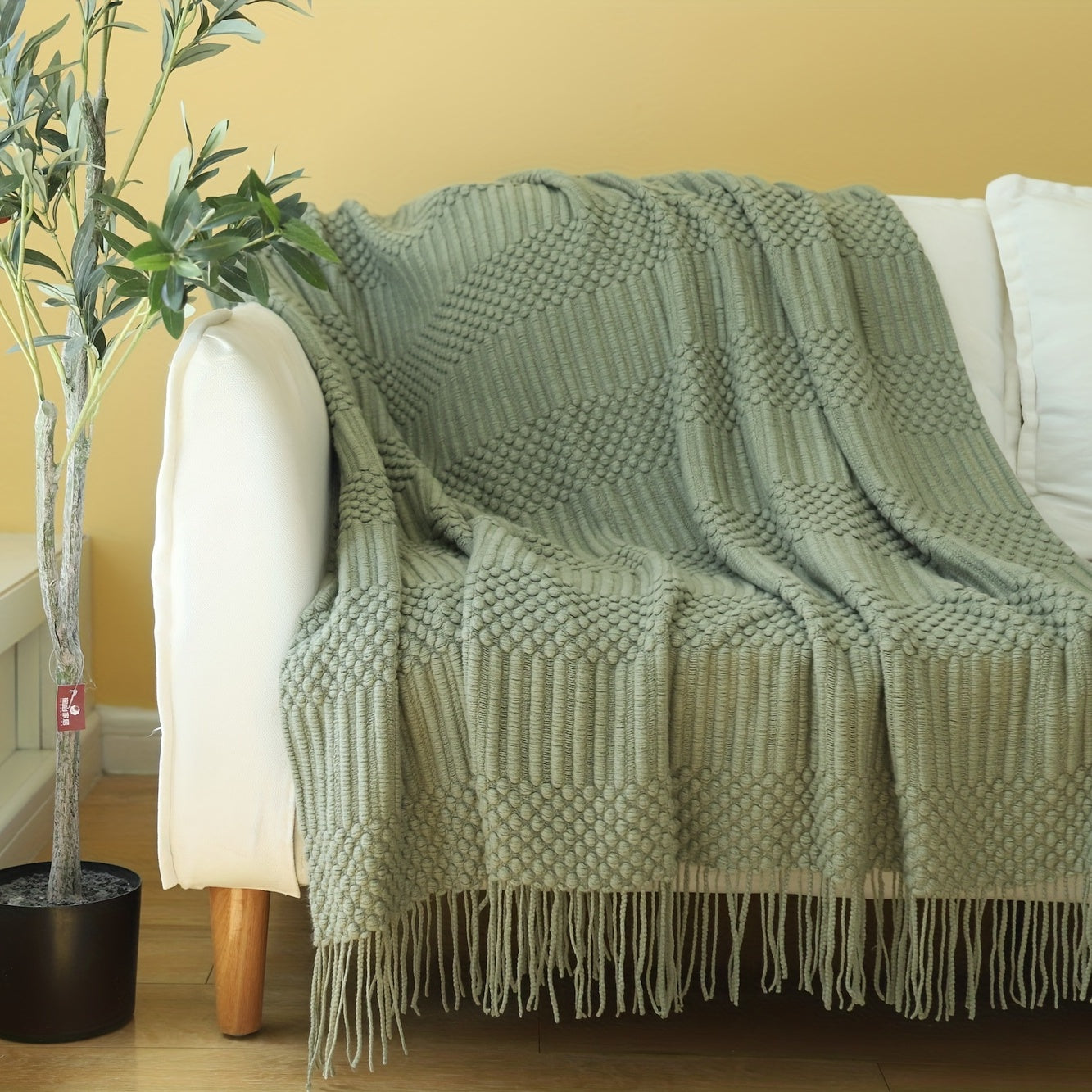 Textured throw blanket made with soft, solid knitted fabric, perfect for decorating your sofa or couch. Measures 127.0cm x 152.4cm.