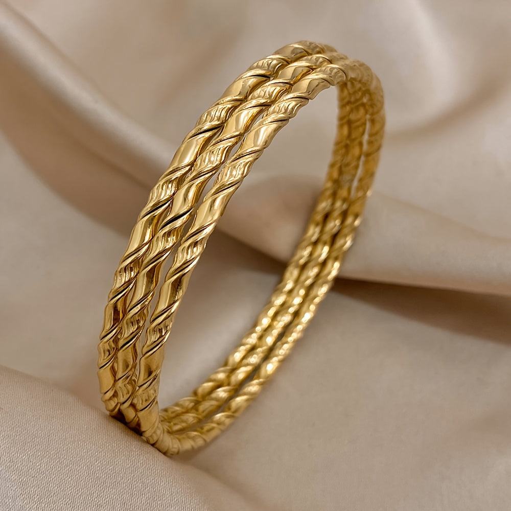 Set of 3 Golden Twist Stainless Steel Bangles, featuring a Chic Classic Tibetan Buddha design. Can be stacked for a stylish look, perfect for both women and men.