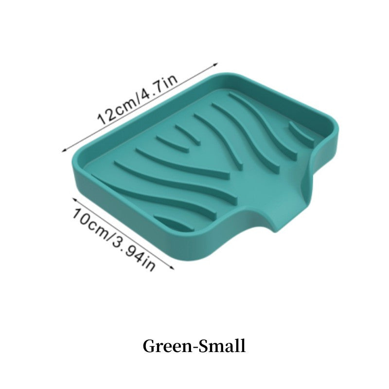 Silicone soap dish with self-draining design for countertop or sink storage in bathroom.