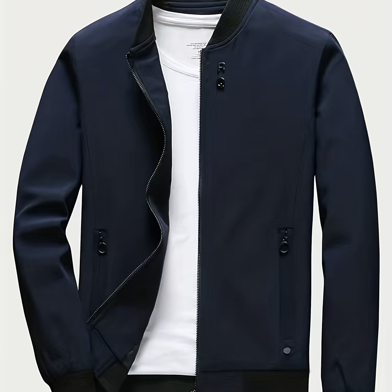 Casual long-sleeved jacket with zip, stand collar, pockets, and slim fit; ideal for spring and autumn.