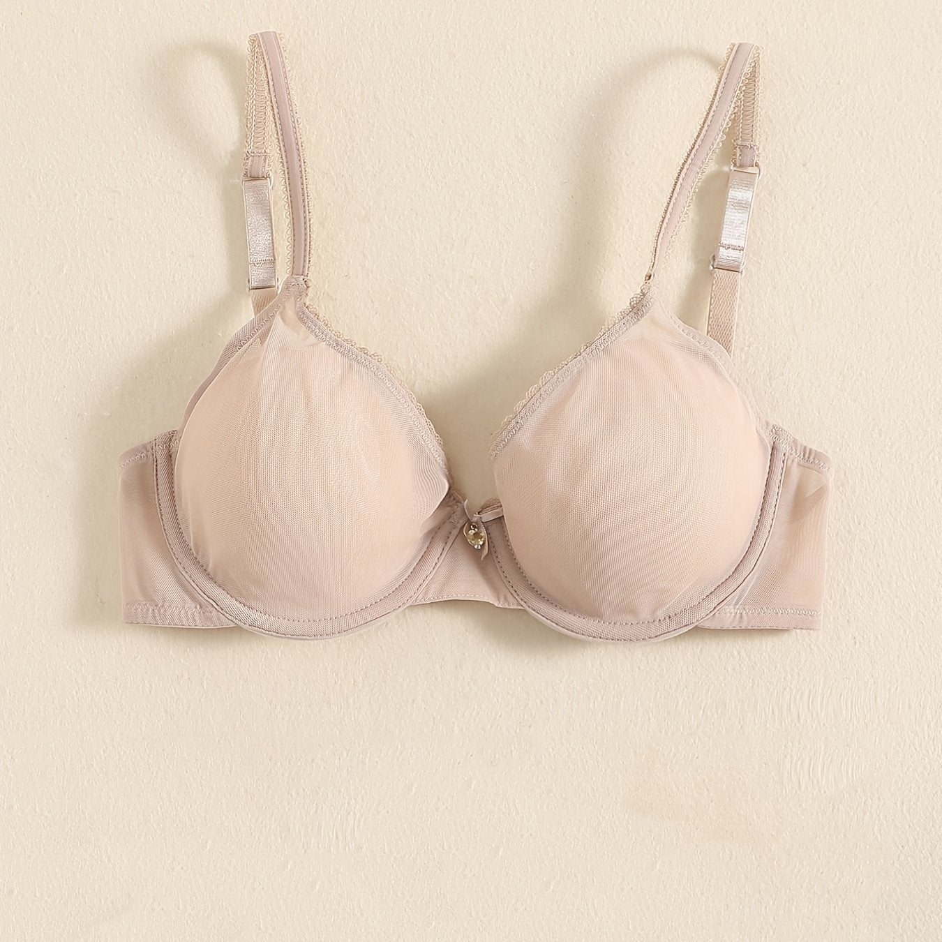 Sheer unlined bra for women in white, breathable nylon and spandex with underwire and thin straps. Hand wash only. Perfect for everyday comfort and sensual style.