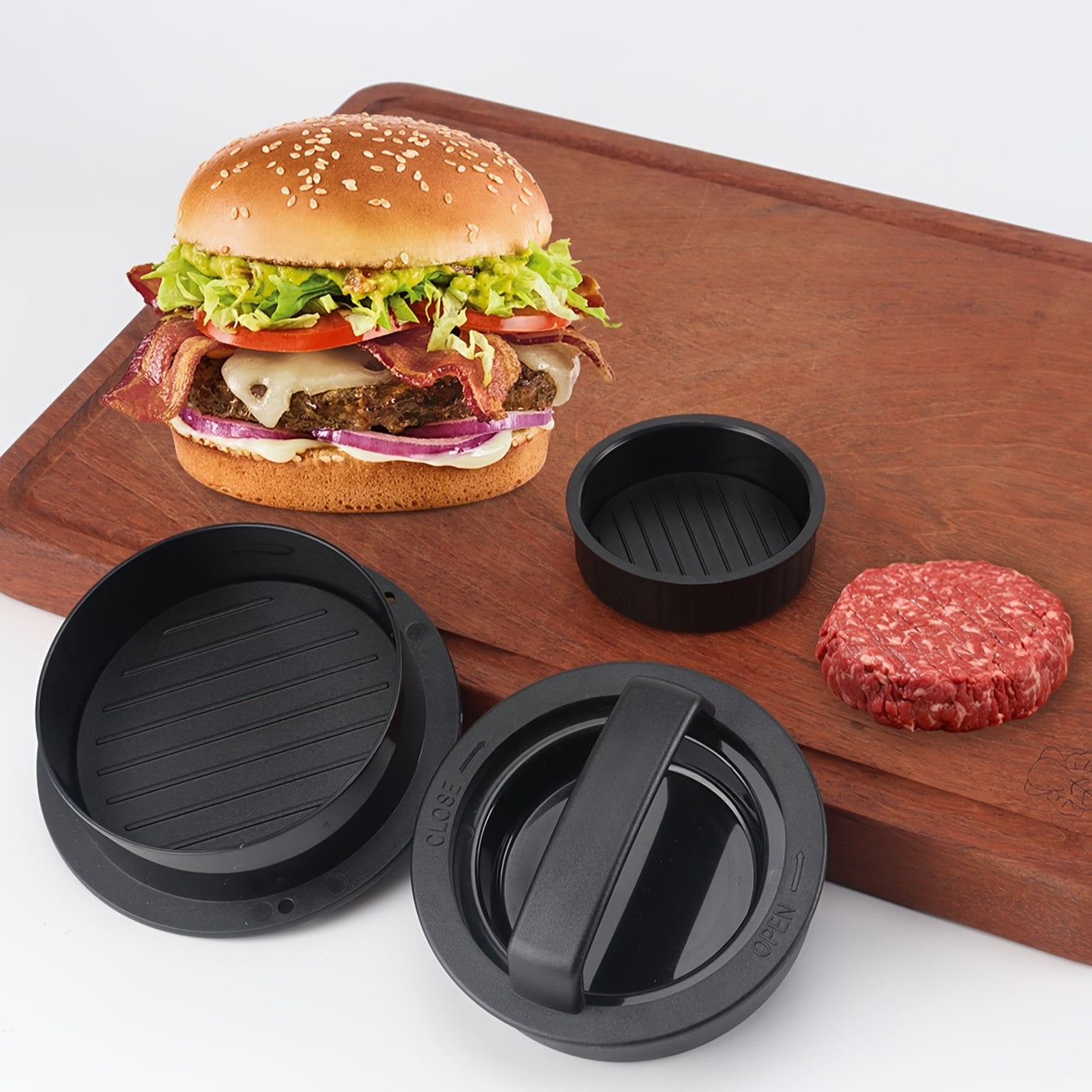 The 3-in-1 Manual Burger Press comes with 100 sheets of baking paper, perfect for making beef, cheese, mini burgers, and vegetable patties. This easy-to-release non-stick coated burger maker is an essential kitchen gadget.