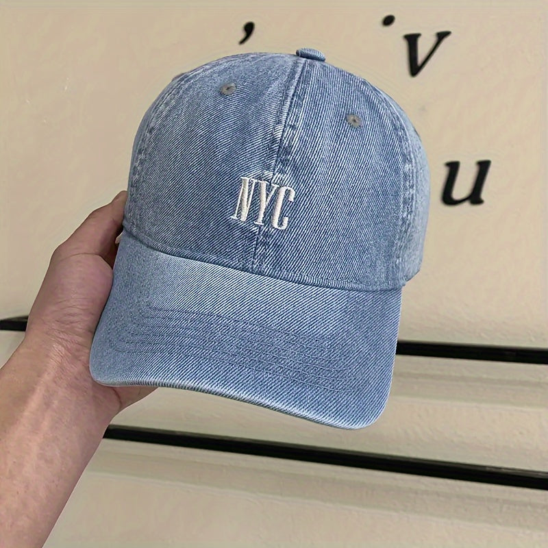 Casual-style denim baseball cap with embroidered NYC logo, adjustable unisex fashion hat for outdoor activities.