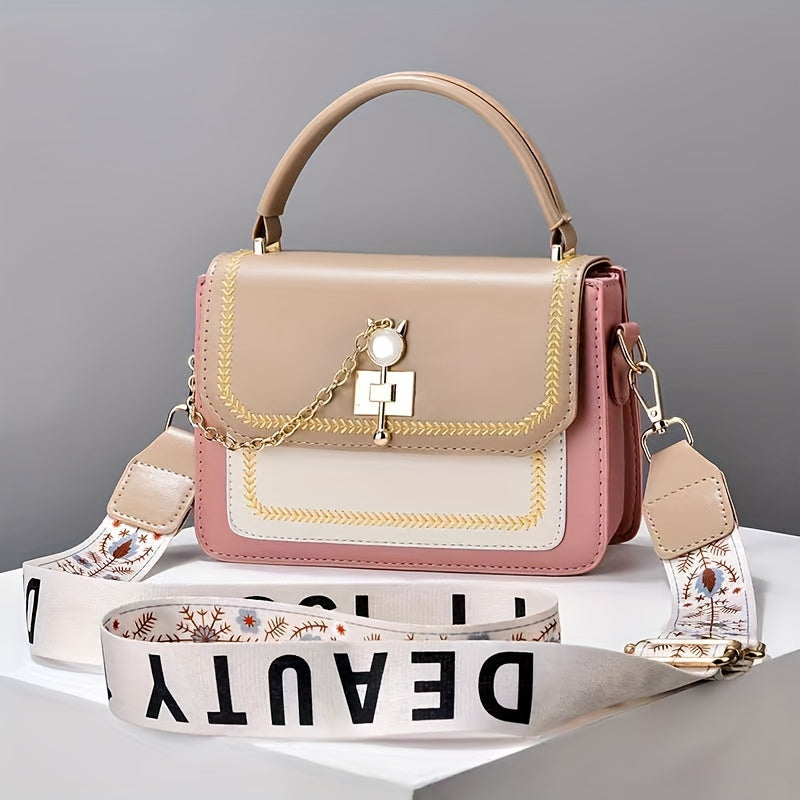 Stylish two-tone women's handbag with adjustable printed strap, made of PU material.