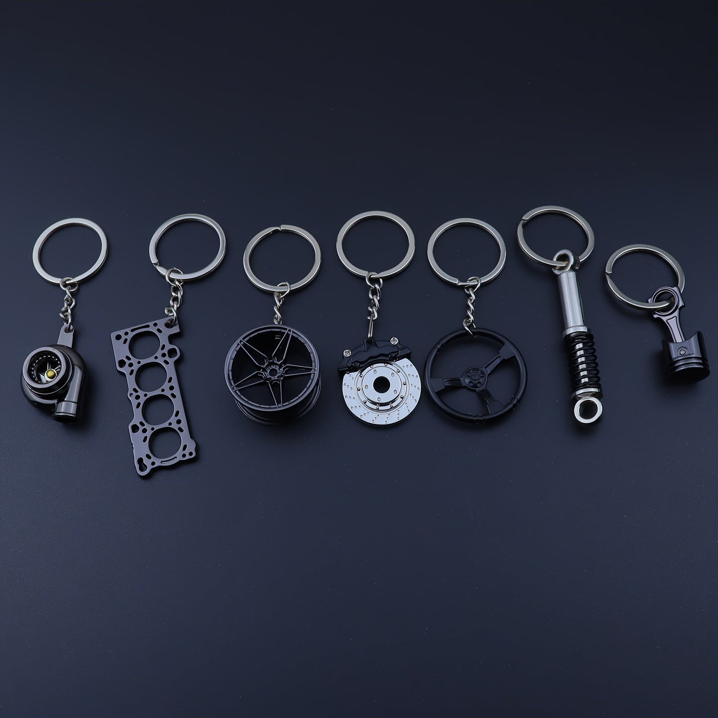 Set of 7 Car Enthusiast Keychains - Sleek Black Zinc Alloy, featuring Engine Block, Turbo, Wheel Hubs, and More - Ideal Gift for Guys