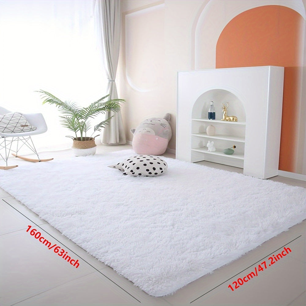 Soft and luxurious pure white plush area rug, ideal for bedroom, living room, and dorm décor. Made from machine washable polyester for easy care.