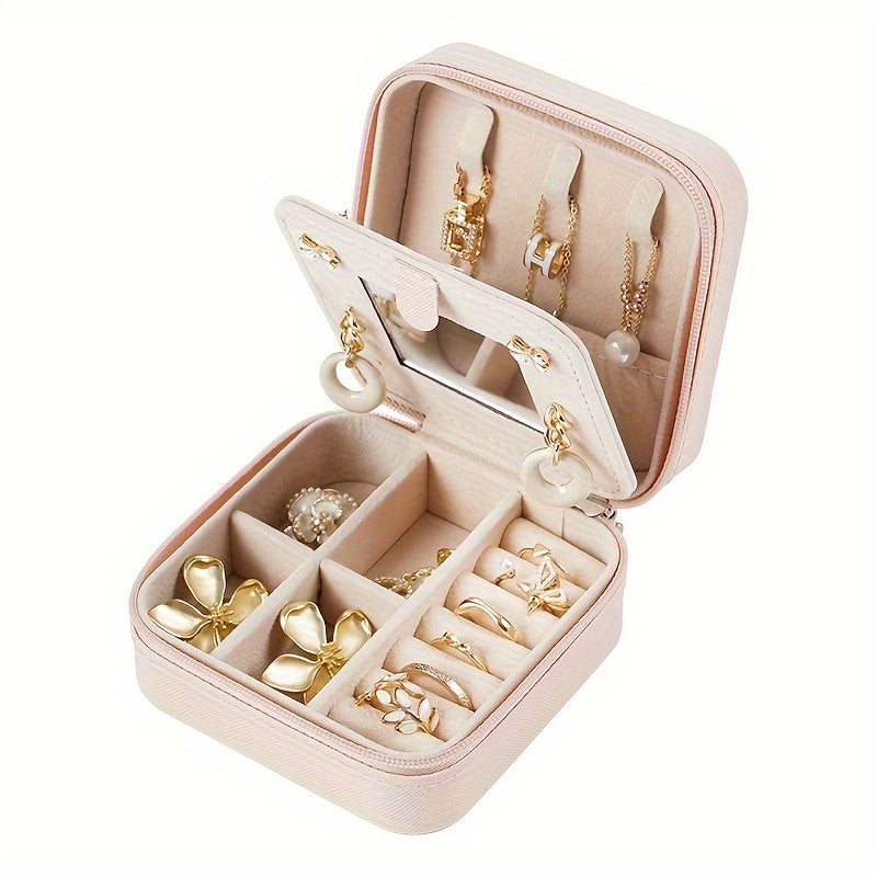 Compact and stylish portable jewelry box with mirror, zipper, and flip cover. Ideal for storing rings, earrings, and necklaces on-the-go.