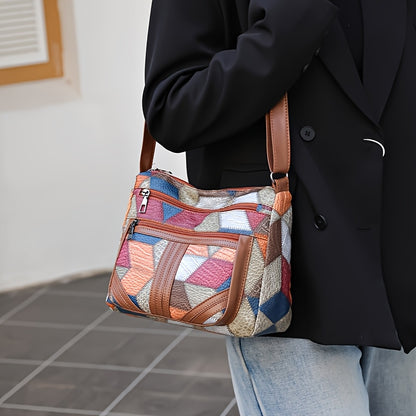 Women's red crossbody purse with adjustable strap, multiple zippered compartments, and geometric stitching design.