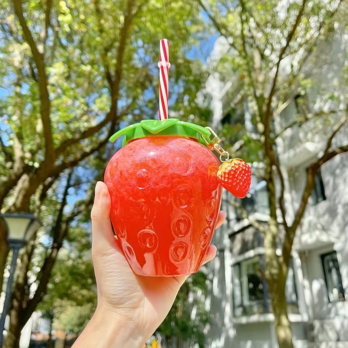 Cute transparent strawberry tumbler with lid and straw, perfect for milk tea or fruit drinks. Great for parties and on-the-go.