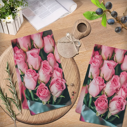 This set includes two ultra-soft kitchen towels with a charming Valentine's Day pink roses design. The towels are highly absorbent and perfect for drying dishes. They also make a great holiday decoration. The towels are machine washable and measure