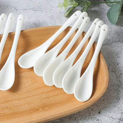 A set of 10 ceramic spoons with a long handle measuring 12.95cm, made of white porcelain for serving coffee, soup, seasoning, and espresso. Perfect for adding an elegant touch to your kitchen and dining essentials.