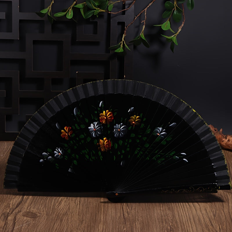 Wooden Spanish folding fan for dancing and home decoration with printed design, conveniently folds for easy storage.