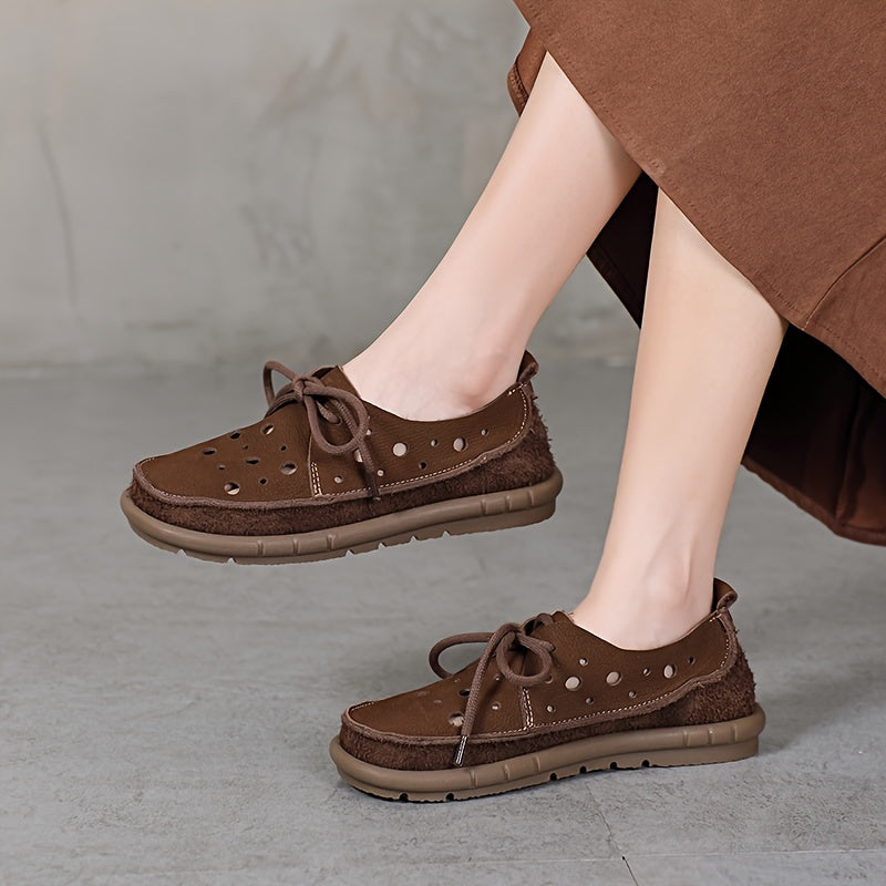 Genuine leather loafers with perforated design and lace-up closure, featuring a soft rubber sole for comfort. Brown leather shoes ideal for summer, offering breathability and style. Stylish