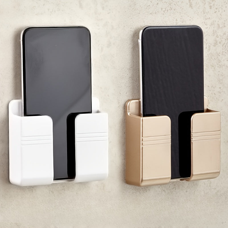 Wall-mounted mobile phone charging stand with storage shelf for organization in bedroom or office.