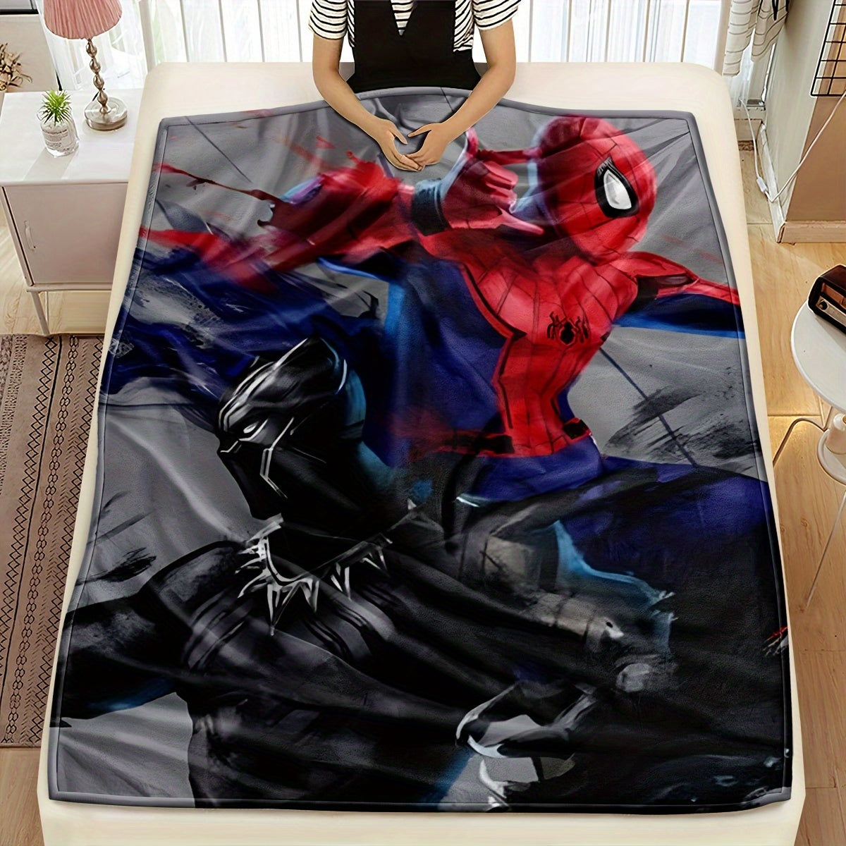 Experience the thrilling battle between Spider-Man and Black Panther on our stylish and detailed red, black, and gray interwoven blankets. Elevate your home with modern and fashionable accessories that bring your superhero dreams to life. Our range of