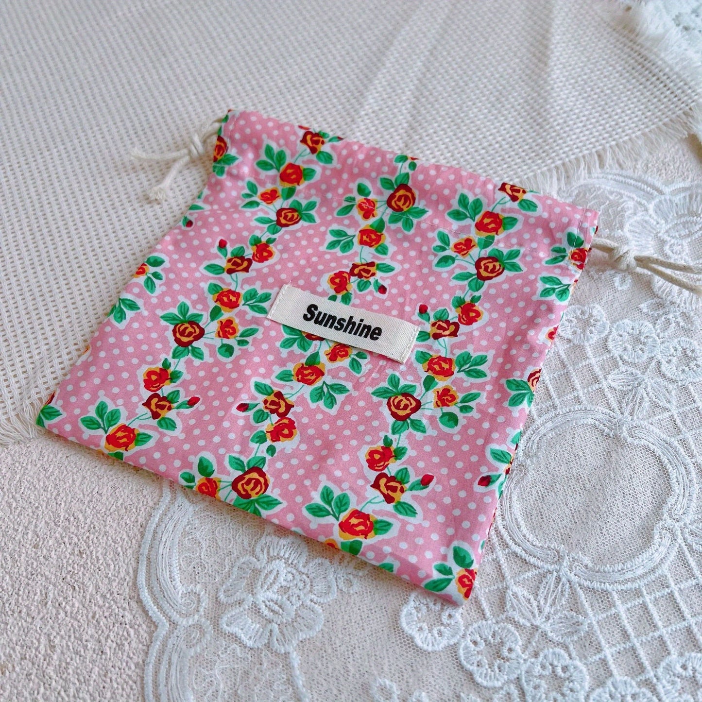 Floral Drawstring Pouch with Pink Rose Pattern - A versatile and high-quality organizer perfect for storing jewelry, cosmetics, and other essentials while on the go. Can also be used as a hanging dust bag or gift bag for various items such as diapers