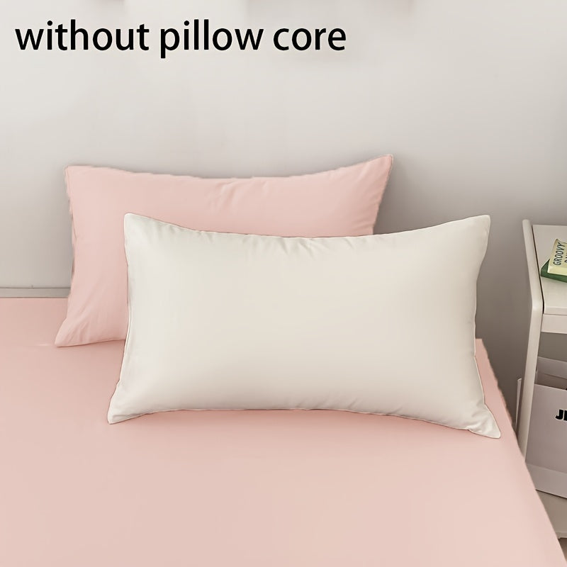 Get two ultra-soft brushed polyester pillowcases, weighing 90g each in a sleek light purple color. These rectangular pillowcases measure 50.8x76.2cm and feature an envelope closure. They are machine washable and perfect for adding cozy comfort to your