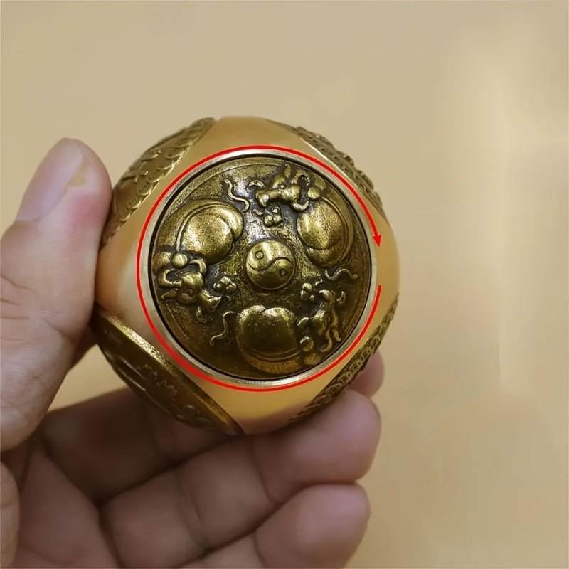 Brass stress relief sphere for prosperity and good fortune.