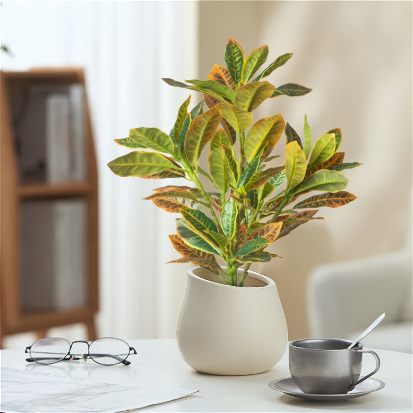 Stylish artificial croton plant with variegated leaves for home decor, perfect for any occasion - pot not included.