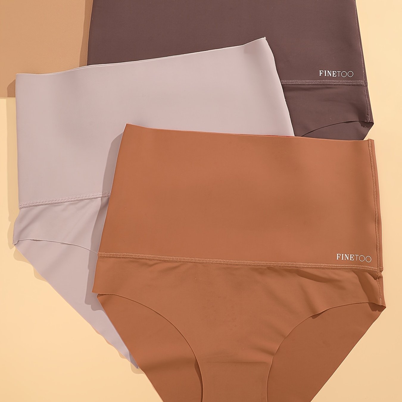 Three seamless solid briefs with high waist design, made of breathable and stretchy material, perfect for women's lingerie and underwear.