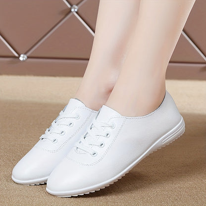 Women's lightweight solid color lace-up flat shoes for casual walking.