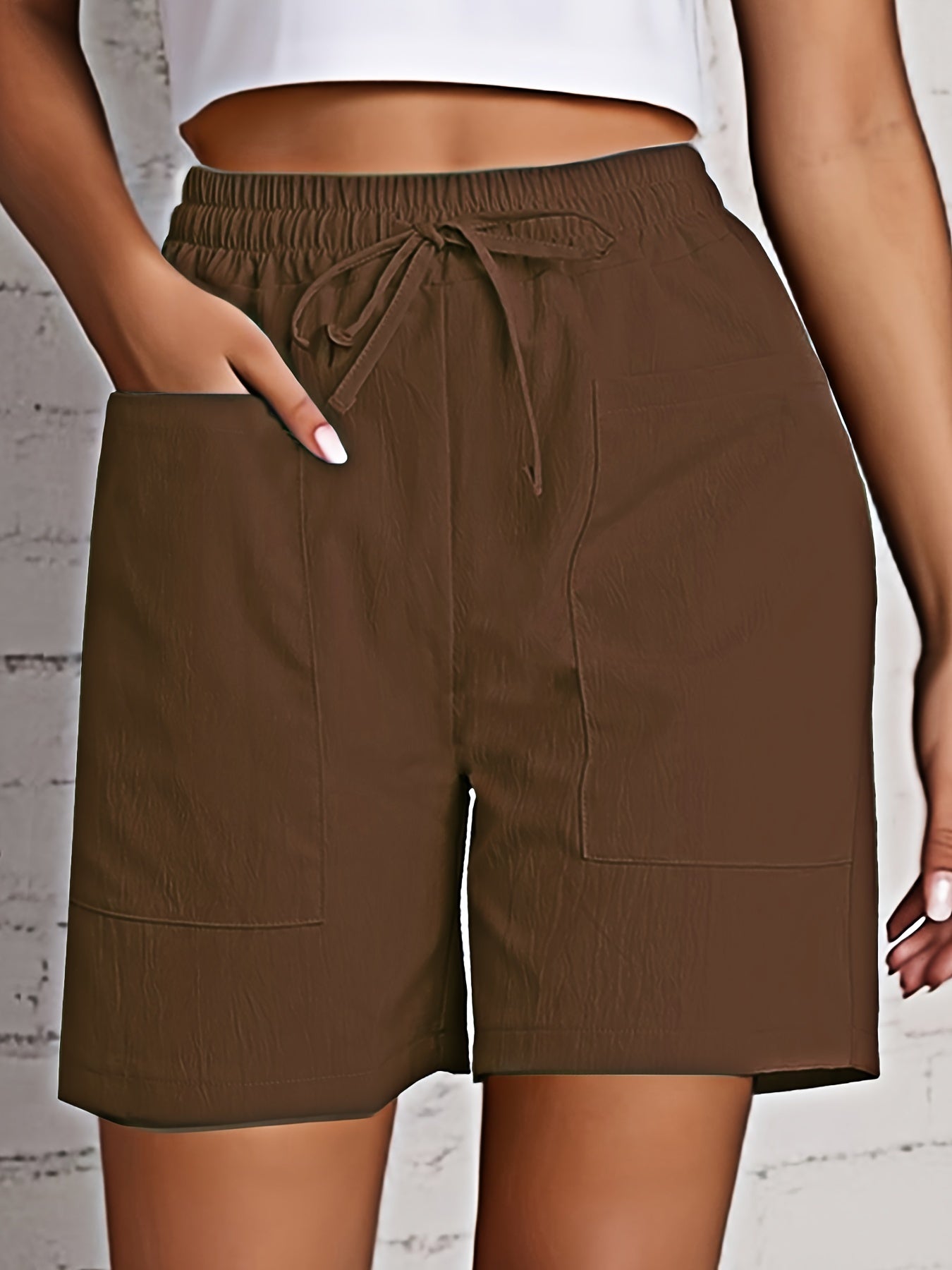 2-Pack of Women's breathable cargo shorts in solid colors. Made of lightweight polyester with dual pockets and drawstring detail. All-season fashion.