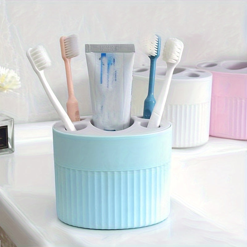 Toothbrush and toothpaste storage rack with detachable shelf for bathroom organization, easy to clean and convenient for makeup brush storage.