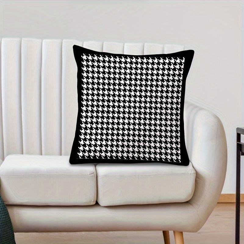 This reversible Contemporary Houndstooth Throw Pillow Cover measures 44.96cm and features a zipper closure. Made of woven polyester, this machine washable cushion case is perfect for living room decor. The black and white design adds a modern touch and