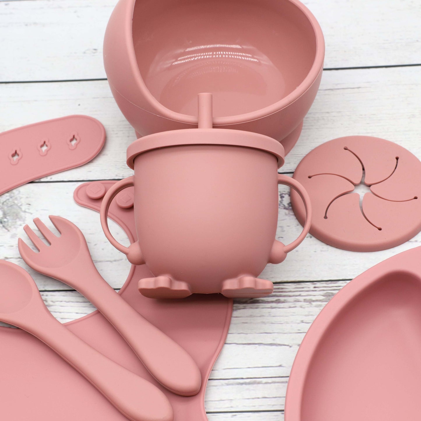 6 piece set of Silicone Feeding Items, featuring a Silicone Bib, Silicone Suction Plate, Silicone Suction Bowl, 2-in-1 Drinking Training Cup. Made of soft and safe, food-grade silicone that is BPA-free. Perfect Easter gift idea.