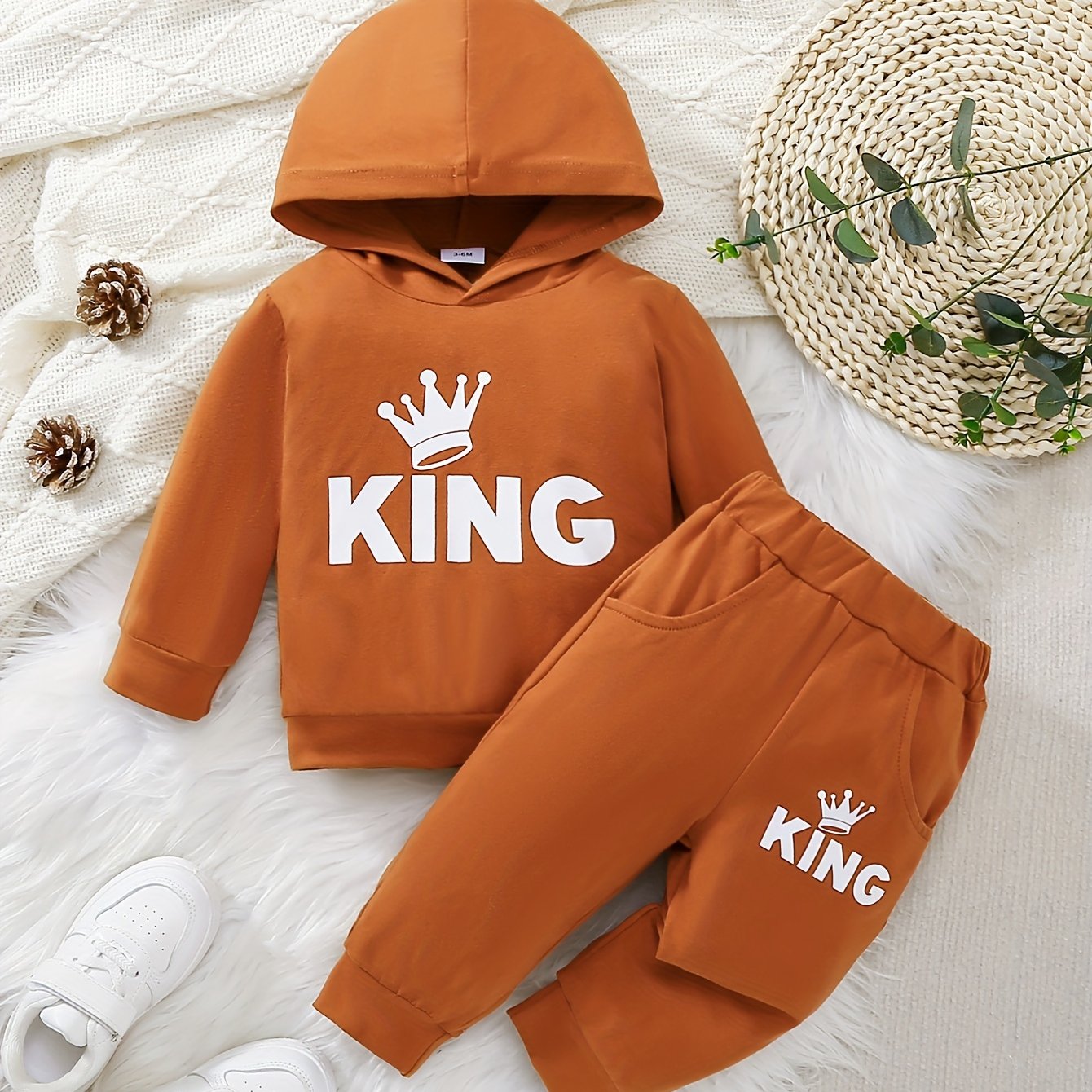 Baby boy's casual outfit set with hooded sweatshirt featuring KING print and matching pants.