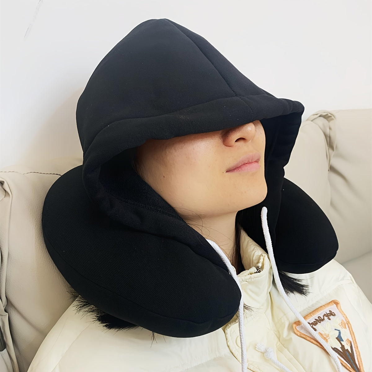 Travel in comfort with this versatile 1pc Particle Hooded U-shaped Neck Pillow, perfect for napping on airplanes.