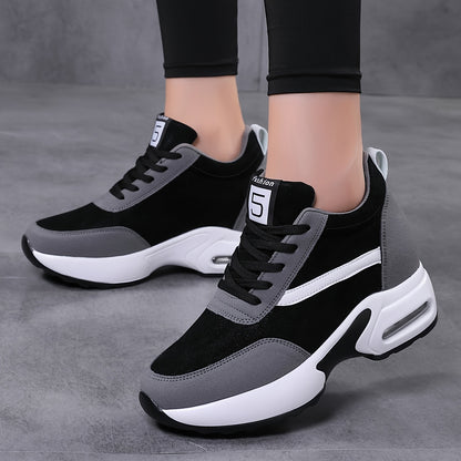 Chunky lace-up sneakers with air cushion for outdoor walks feature hidden heel for added fashion.