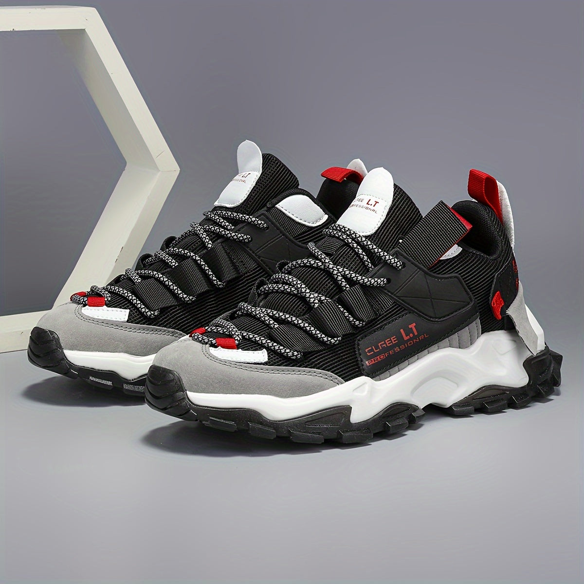 Men's running sneakers with geometric/letter print design, breathable and comfortable for all-season wear. Features lace-up closure for outdoor and casual activities.