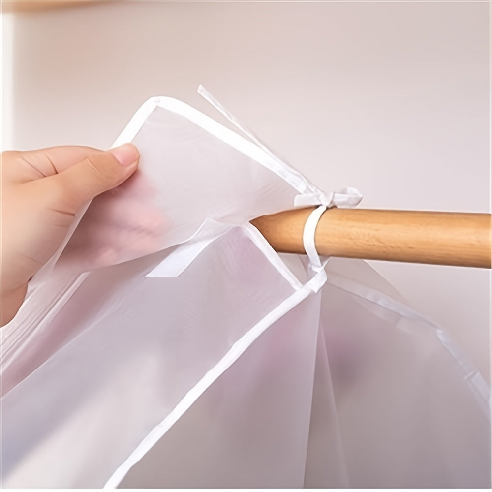 Protect your clothes with this lightweight, translucent garment cover. It is dustproof and waterproof, featuring a full zipper, magic tape, and strap for coats, dresses, and windbreakers. Dimensions are 59.99x50.01x119.99 cm.