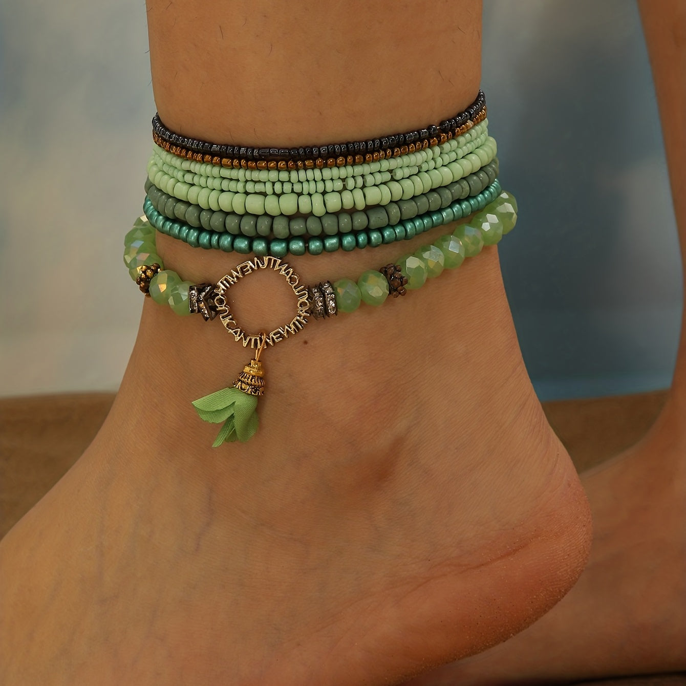 Set of 8 green rice beads beaded anklets for women, perfect for everyday wear and can be worn stacked as ankle bracelets.