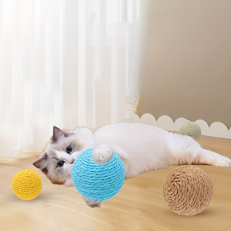 Interactive sound-making cat scratching ball toy made of cardboard material for cats to relieve play with their pet companion.