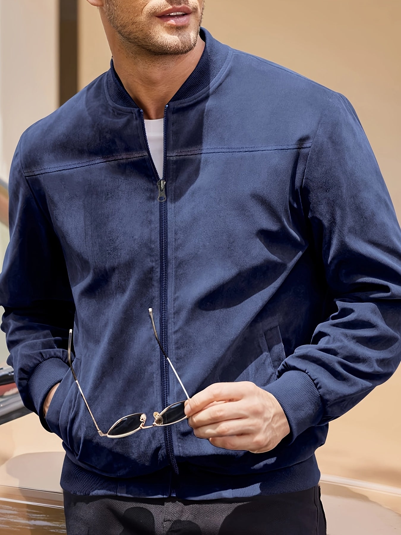 Casual and stylish navy blue jacket for men, lightweight with stand collar and full-zip design. Made of polyester blend, ideal for spring and autumn.