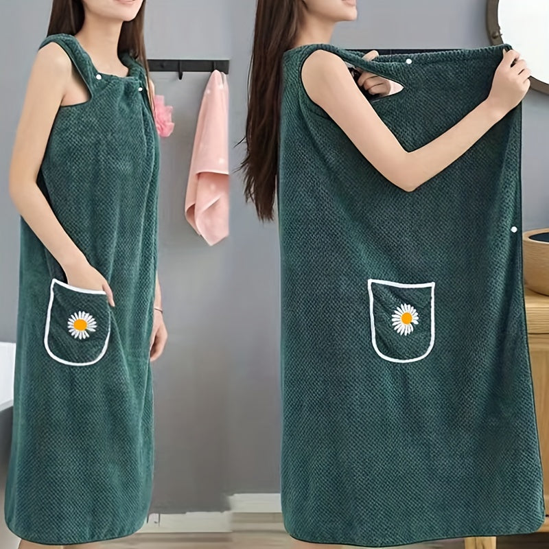 Adults' wearable bath towel features pockets, buttons, and quick-drying, absorbent material. Perfect for home spa or sauna use.