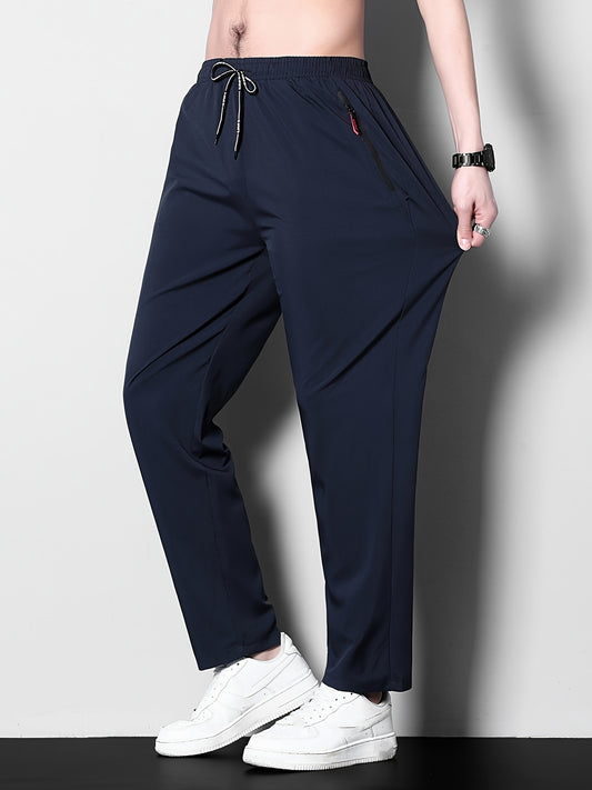 Men's plus size casual sports pants, made of stretchy polyester in a solid color with a regular fit, zipper detail, part of the spring/summer collection.