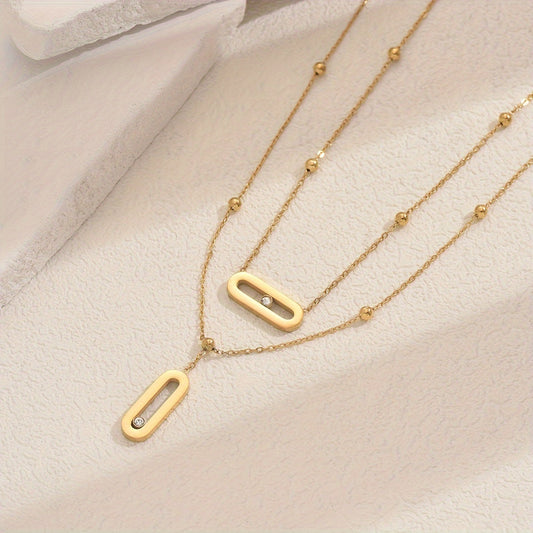 Elevate your look with this sophisticated French-inspired 18K gold plated stainless steel necklace featuring double layers and sparkling rhinestone accents. The versatile geometric pendant is perfect for women, ideal for both everyday wear and as a