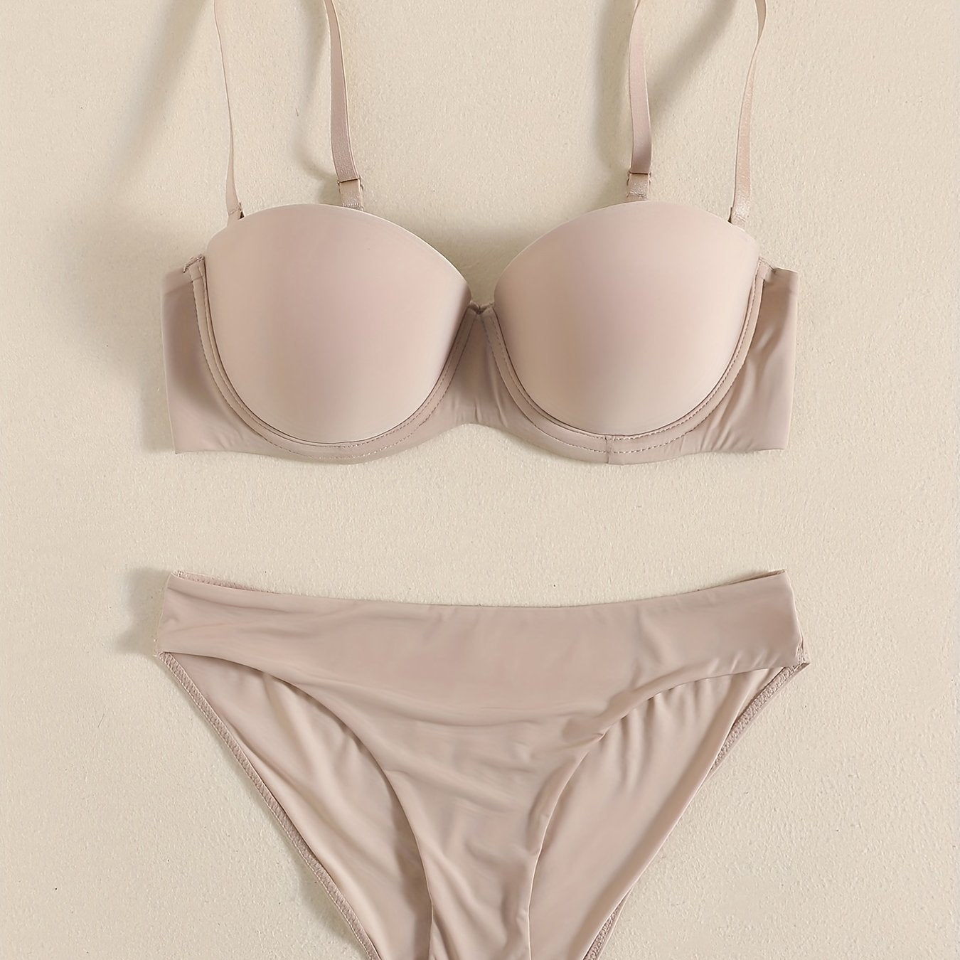 Smooth lingerie set including seamless bra, balconette bra, and bikini panties for women.