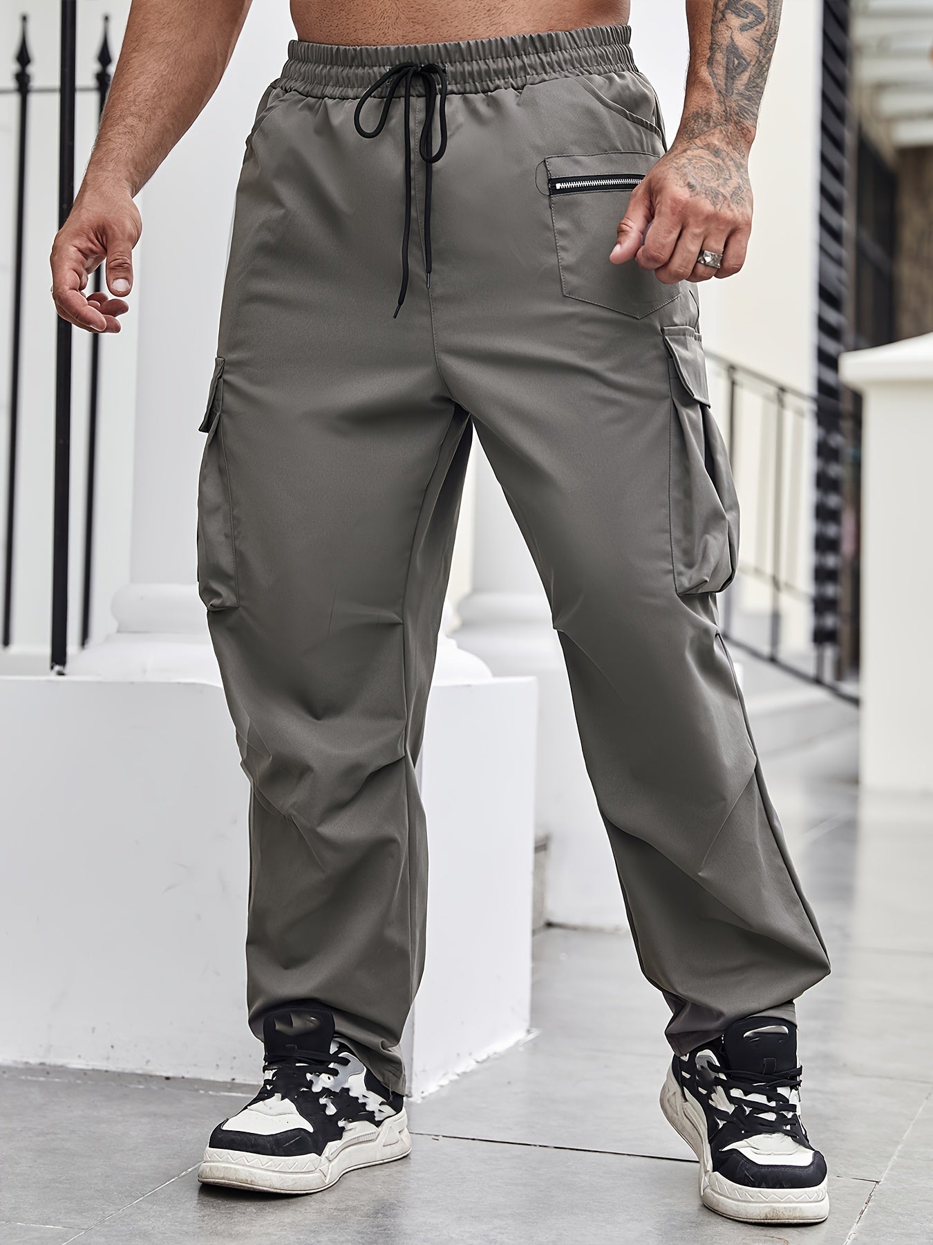 Durable polyester cargo pants for men in plus sizes, suitable for all seasons.