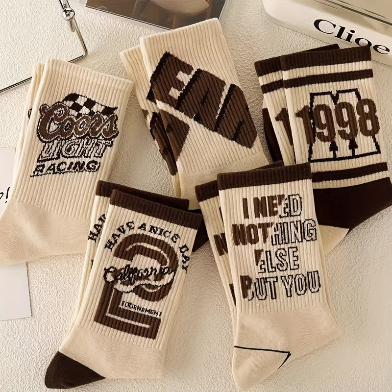 4 pairs of retro letter pattern crew socks for men, ideal for outdoor activities.